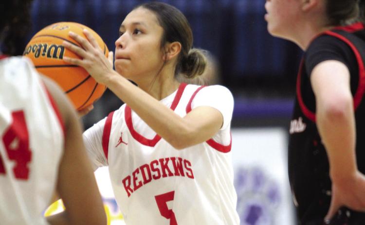 McLoud junior Kaitlyn Valdez concentrates on her foul shot during Bethel’s First United Tournament game against Perkins-Tryon, Dec. 12. The Lady Redskins won that game, 57-32; ended Eufaula on Dec. 13, 42-28; and beat Blanchard on Dec. 14, 33-24, to become tournament champions. Countywide & Sun/Natasha Dunagan