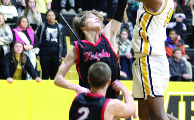 Tecumseh junior Jase Edwards aims for the bucket in the last 30 seconds of the fourth quarter during the Class 4A District game against Crossings Christian on Feb. 17. The Savages lost 67-84. Countywide &amp; Sun/Natasha Dunagan