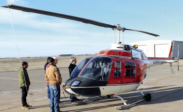 Students and instructors of the Gordon Cooper Technology Center Aviation program check out the recently purchased Bell TH-57 helicopter. Photo provided by GCTC