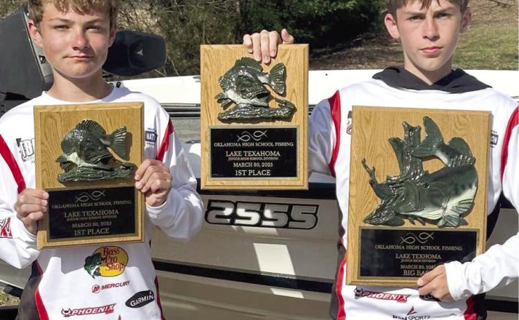 North Rock Creek's Slayton Graham (L) and Rody Wright (R) are team members of the NRC fishing team. They won the junior division of the OK HS FISHING Tournament at Lake Texoma with a stringer of 17.87 lb. Rody had the big bass at 4.77 lbs. out of over a hundred teams. Photo courtesy of Todd Burch