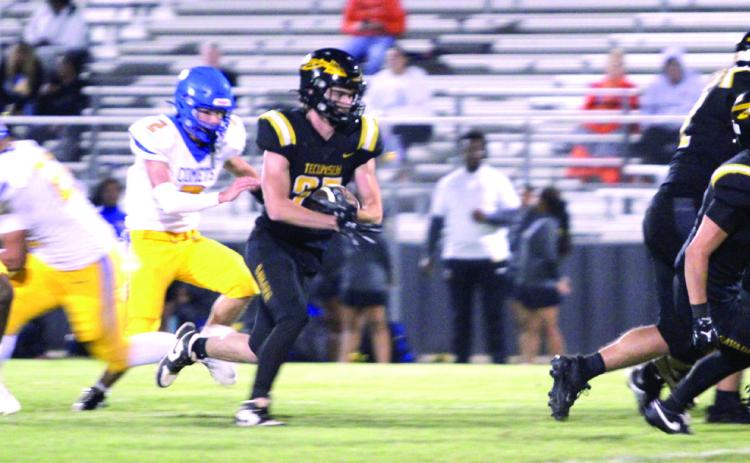 Tecumseh senior Wyatt McElfresh cradles the ball just ahead of the defense during the season-opening home game against Classen SAS at NE on Sept. 5. The Savages won, 36-8. Their next game will be tomorrow, Sept. 12, at Seminole, beginning at 7:30 pm. Natasha Dunagan, Countywide &amp; Sun