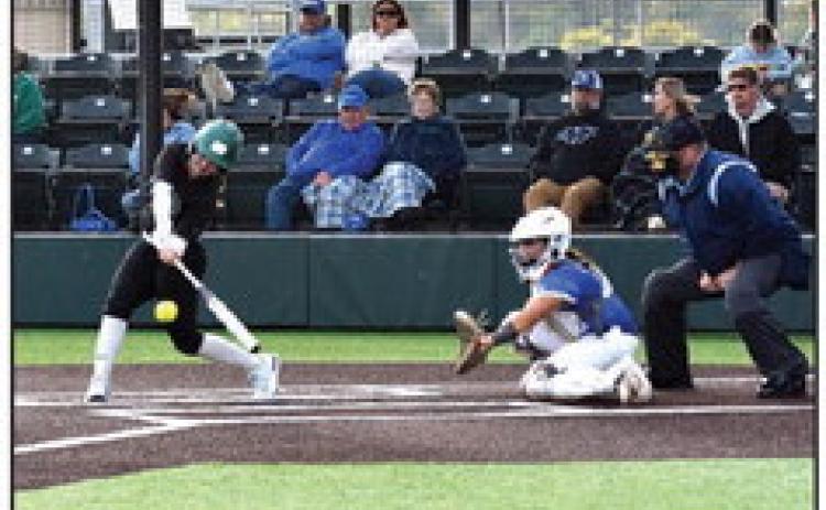 Right: Tecumseh High School Alumna, Jessi Hull, now playing for OBU, hits a single before eventually making it across home plate to score in the Fall Softball Scrimmage against Eastern Oklahoma State held at FireLake Softball Complex on Oct. 27.