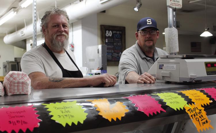 Brothers Grady and Scott Oliver stand ready for customers at the counter of Hardesty Market & Deli, which has been located at 613 N. Pottenger in Shawnee for two years now. The past year held health challenges and the destruction of their former historic location at the corner of Gordon Cooper Drive and Hardesty Road, but their business has been "twice as busy" as before the move, and they have continued to share their success with several non-profit organizations. Countywide & Sun/Natasha Dunagan