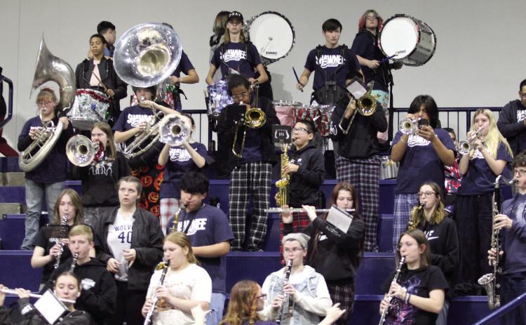 The Shawnee High School Band plays in the stands during the Dec. 17 Lady Wolves home game. Countywide & Sun/Natasha Dunagan