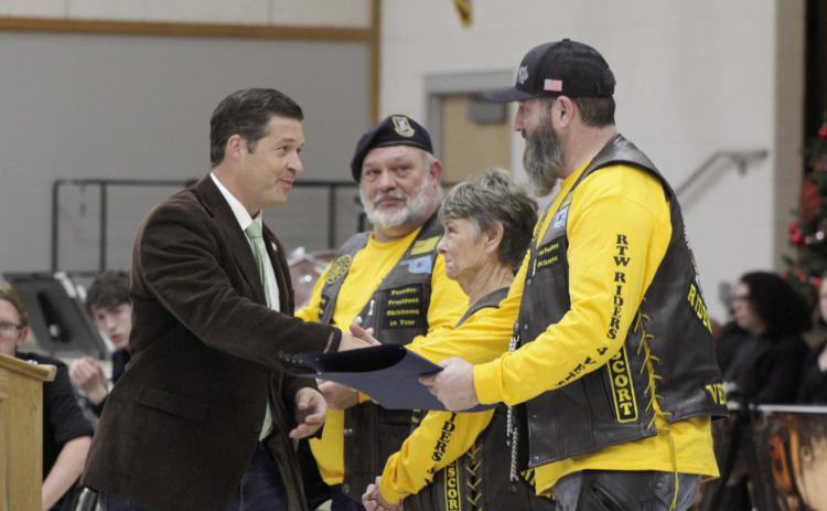 Oklahoma State Senator Shane Jett presents Citations of Commemoration to Cory “Shockwave” Stephens, the VP of Roll to Wreaths Riders 4 Vets Riding Club, far right; as well as, Club President Ralph “Rowdy” Butler and Marie “Mama Ree” Butler for their service to veterans at the National Wreaths Across America Day event in Tecumseh, Dec. 16. Countywide & Sun/Natasha Dunagan