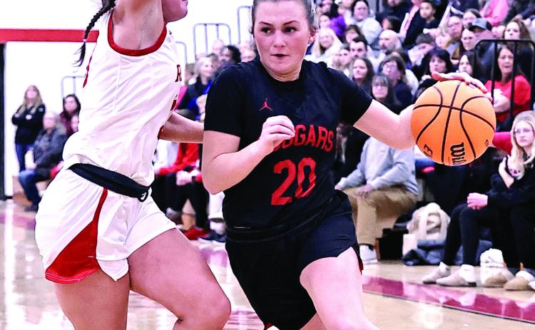 NRC's Aubree Shivelhood drives to the lane and gets fouled by the McLoud player. McLoud took the win, 62-71. Photo Provided by Gowin Photography