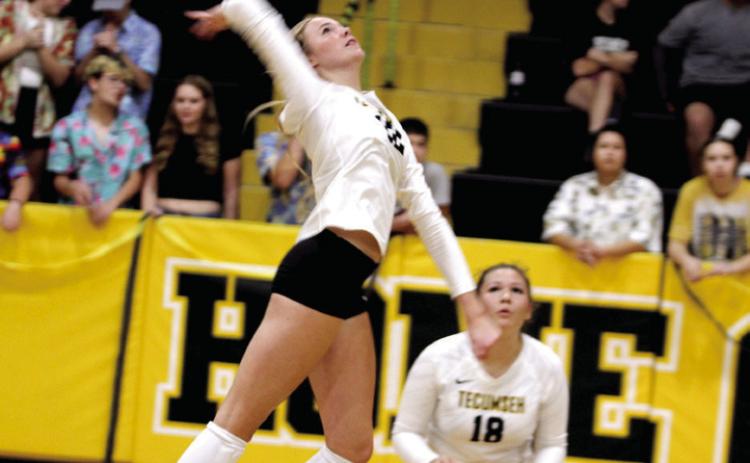 Natasha Dunagan, Countywide & Sun Tecumseh senior Kennadee Mason jumps to attack the ball during the Sr Night match with Cache on Oct. 2. Also shown is sophomore Aivah Dodgion.