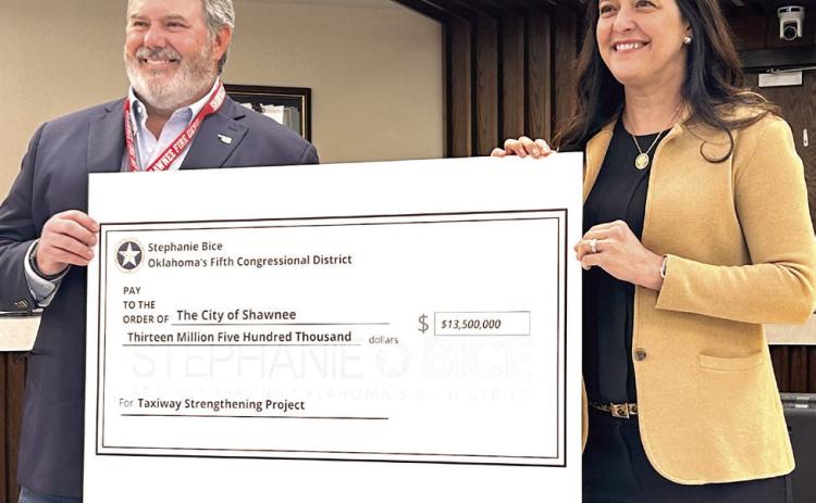 Congresswoman Stephanie Bice (right) presents a $13.5 Million check to Shawnee Mayor Eric Stephens. The Community Project Funding Grant - the largest of 15 grant requests approved for Bice - will be used to improve the runway and taxiways at the Shawnee Airport.