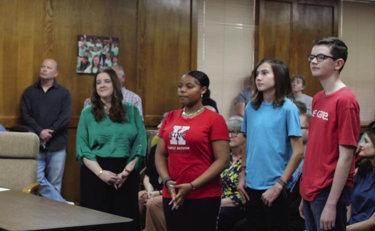 Coding teacher Krista Farris introduced three of her eighth-grade students in the new App Creator class at Shawnee Middle School, and they explained their projects to the Shawnee Board of Education, March 6. They are, from left, Amaya Townes, Duke Wright and Cooper Dunn. Countywide & Sun/Natasha Dunagan