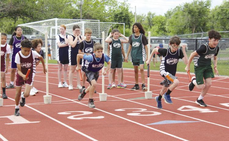 Four sixth-grade boys from Shawnee Middle School start off the Division One Shuttle race.
