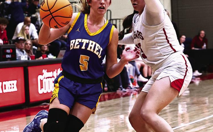Bethel High Schools Brooklyn Duff drives to the basket past NRC's Morgan Campbell. Photos courtesy of Gowin Photography