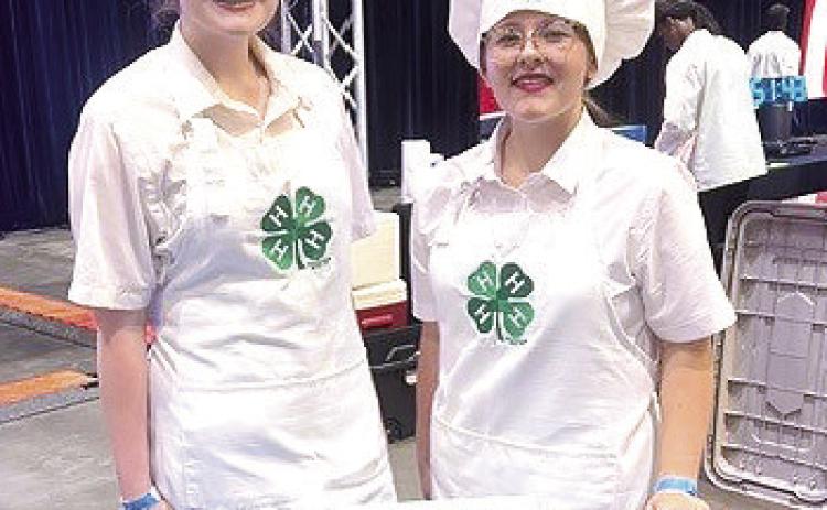 Tori Nelms of North Rock Creek, left, and Madison Maddox of Dale represented Oklahoma 4-H in the "Great American Seafood Cookoff: 4-H Edition" on July 26 in New Orleans, LA, and took fourth place with their Pecan-Crusted Catfish with Sweet Potato Purée and Peach Andouille Sausage Maque Choux, using Oklahoma-sourced ingredients. Over the past year, they have competed in other 4-H cooking contests to earn their place at the seafood competition. Photo provided