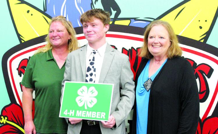 Tecumseh 4-H Club member Taylor Marrs was given the Pottawatomie County 4-H Senior Hall of Fame Award during the 4-H Awards Banquet, held at the North Rock Creek High School Cafeteria on Oct. 23. He is shown with his mother, Sara McGaha, left, and his grandmother, Barbara McGaha. Countywide & Sun/Natasha Dunagan