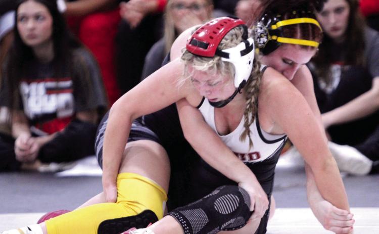 McLoud's Addison Adams, front, and Tecumseh's Kylei Gokey think through their next moves in the 140-weight class during the McLoud Tri-Dual on Jan. 8. Gokey won the match by pin. McLoud, Tecumseh and Harrah girls and boys competed at the event. Natasha Dunagan, Countywide & Sun