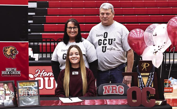 North Rock Creek’s Molly Campbell signed to continue playing softball at Oklahoma Christian University She is pictured with her parents, Maria and Robert Campbell. Photos courtesy of Gowin Photography
