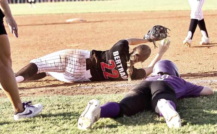 NRC's Morgan Bertram gets the out at first to help clench the home field advantage for Regionals in the 3-2, 9th inning victory, over Mannford. Photo courtesy of Gowin Photography