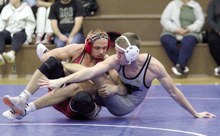 McLoud’s Wyatt Hewer and Bethel’s Zac Griffith compete in the 150 weight class during the Dec. 3 Bethel dual. McLoud won the season-opening event, 57-16. Countywide & Sun/Natasha Dunagan
