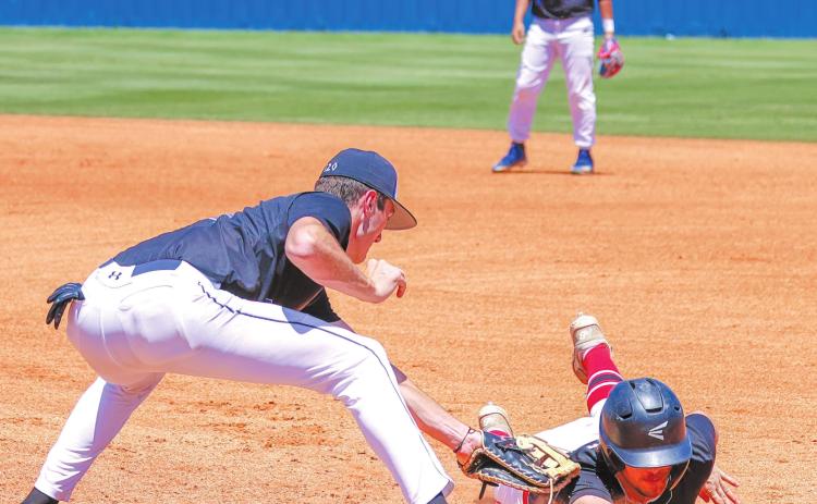Bethel junior Bronc Robbins tags a runner just as he touches first base during the Class 3A State Baseball Tournament at Choctaw High School on May 12. Bethel lost against Keys (Parkhill), 8-16, after five straight wins in the Districts and Regionals. Photo provided by Richelle Treece.