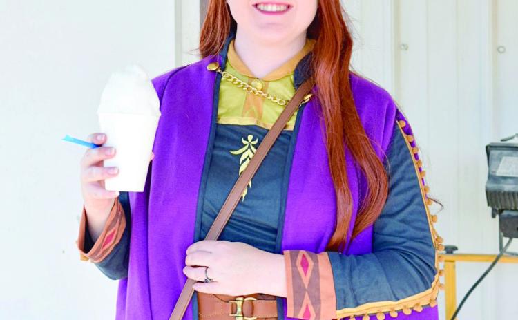 Pictured left, Princess Anna, aka Rachelle Briscoe of Shawnee, enjoys a free “Frozen” treat at the Johnson Festival held on September 30th at the Horseshoe Bend Community Center. Countywide/ Sun Julie Talton