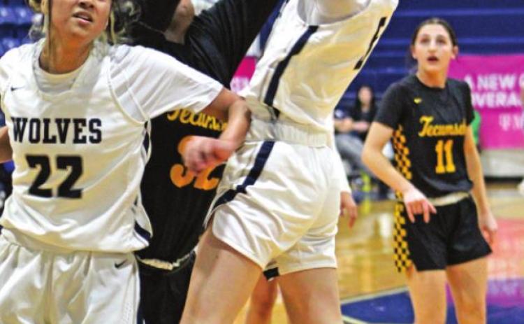 Shawnee’s Ansley Orrell (#5) makes her shot during the home game against Tecumseh on Jan. 14. Also shown, from left, are Amaya Martinez (#22), Shantel Evans (#32), and Kenzli Warden (#11).