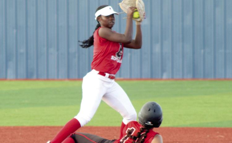Macomb senior McKenzie Brummett slides into second base as Earlsboro sophomore Zeaonna McGregor makes the catch for the out during the April 2 game played at the BCM Sports Complex in Seminole. The Lady Wildcats beat the Lady Hornets in overtime, 8-7. Photos by Natasha Dunagan, Countywide & Sun. Click on the camera banner ad below to see all our photos from the game!