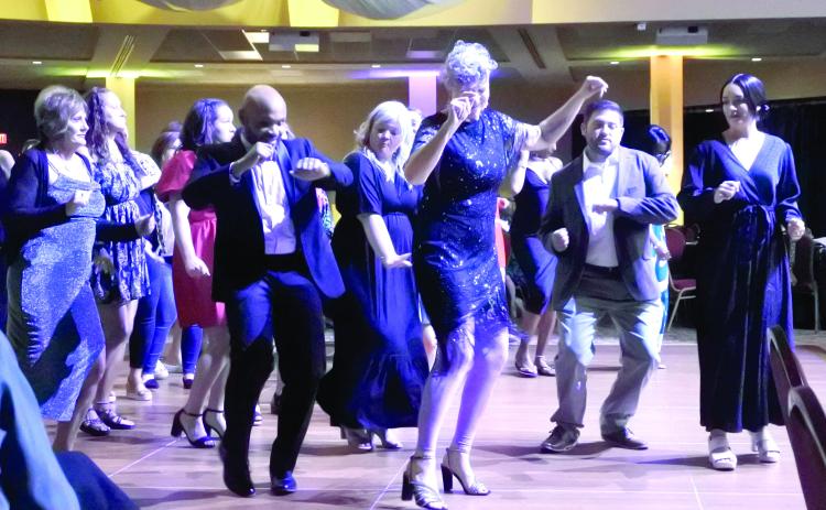 Attendees of the Shawnee Rotary Dancing With Sahwnee enjoyed some line dancing. Pictured from left are Kaye Steele, Pottawatomie Go Executive Director John Bobb-Semple, Small Business &amp; Entrepreneurship Coordinator Cama Watts, Shawnee City Manager Andrea Weckmueller-Behringer, City of McLoud Mayor Daniel McClure, and his wife Stormy McClure. Counttywide &amp; Sun/Suzie Campbell