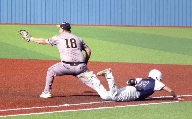 Asher junior Beau Willis dives across first base after hitting a single during the Class B Baseball Regional game against Boswell. Natasha Dunagan, Countywide &amp; Sun