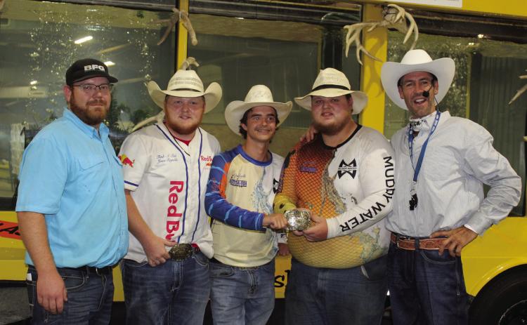 Amadeus Sandifer and Jacob Vincent, with belt buckle, tied for first place in the Pottawatomie County Free Fair Big Bass Contest. Both of their fish weighed 5.7 pounds each. There was also a tie for second place between Grayson Jones and Cruz Winn, who both caught 2.12-pound bass. The first-place winners will receive $220 and a belt buckle, and the second-place winners get $110 each. Also shown, from left, are Trent Boles, Josh Vincent, Sandifer, Vincent, & Fetch-n-Fish tank owner Jason Reynolds.