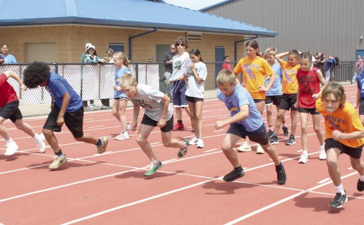 Shawnee sixth-grade boys from area independent elementary schools take off from the starting line in the Division II 100-meter dash during Kiwanis Little Olympics, held at Jim Thorpe Stadium on May 1. The independent schools in Division II include Grove, Pleasant Grove, South Rock Creek, North Rock Creek and Liberty. Photos by Natasha Dunagan, Countywide & Sun. See all our photos from the event by clicking on the camera banner ad below.