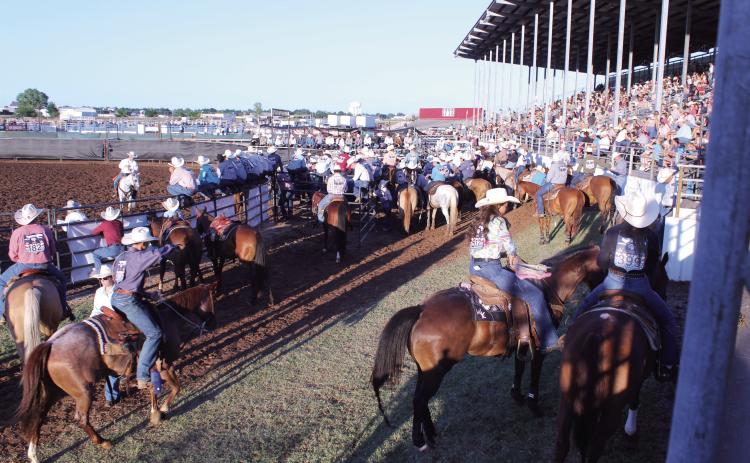 Contestants for the International Finals Youth Rodeo wait for their events, as a packed house watches, on opening night, July 12, at the Heart of Oklahoma Expo Center in Shawnee. There are 937 contestants from 38 states and three countries this year. Natasha Dunagan, Countywide & Sun