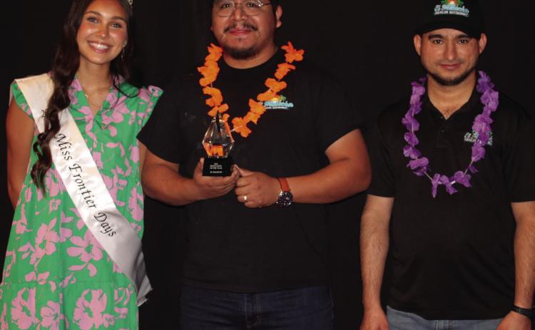 Miss Frontier Days Jalee Meyers poses with Marco Villa and Miguel Ramirez, with El Malecon, who received Business Renovation of the Year during the Tecumseh Chamber of Commerce Annual Meeting & Awards Banquet, held at the Grand Casino Hotel and Resort on Nov. 21. File photo