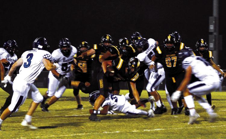 Tecumseh senior Garrett Chaffin breaks away from a tackle to sprint to the end zone during the second quarter of the home game against Newcastle on Sept. 23. The Savages lost 7-35. Countywide &amp; Sun/ Natasha Dunagan