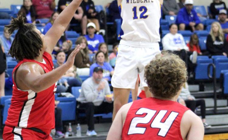 Bethel’s John Gordon sinks a shot during the Dec. 9 game against McLoud in the first round of the First United Bank Classic in Bethel. The Wildcats won 58-37 but went on to lose to Clinton, 47-51, on Dec. 10, and Perkins-Tryon, 35-56, Dec. 11. Out of eight schools, the Prague boys came out on top. Countywide &amp; Sun/Natasha Dunagan