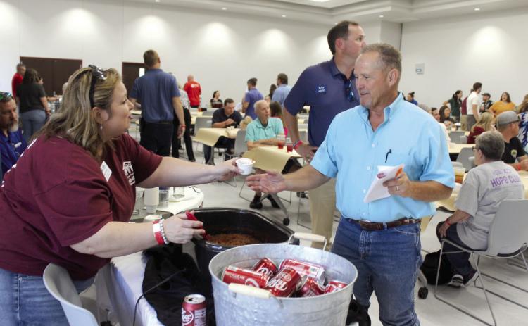 Rose Rock Habitat for Humanity Community Engagement Coordinator April Grant hands a bowl of chili to State Representative Danny Sterling, who was a judge during the Second Annual United Way Kickoff Cookoff, held at the Gordon Cooper Technology Center Safety Center on Aug. 27. There were 21 entries from nonprofits, businesses and churches in the event, said United Way of Eastern Frontier Country Executive Director Sandy Vanderburg. Countywide & Sun/Natasha Dunagan