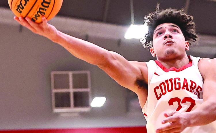 North Rock Creek’s Caleb Hawkins goes up for the bucket. The boys won their 3rd tournament of the season beating Broken Bow.