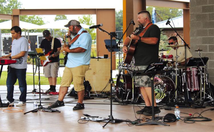 Crowned by Grace performs during the Second Annual Hug-a-thon at Woodland Veterans Park on Aug. 2.
