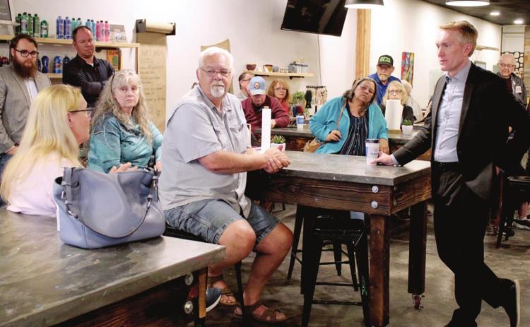 Linda Page, far left, voices her appreciation of U.S. Senator James Lankford’s honesty and accountability after he spoke at Coffee N’Crafts in Shawnee on April 19. Countywide &amp; Sun/Natasha Dunagan