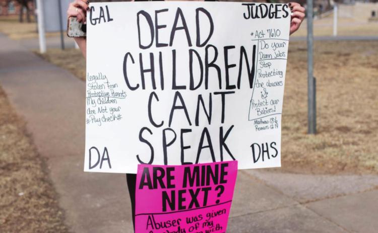 Chelsey Pearson joins protestors outside the Pottawatomie County Courthouse Friday, Mar. 4. Countywide &amp; Sun/Loren Knight