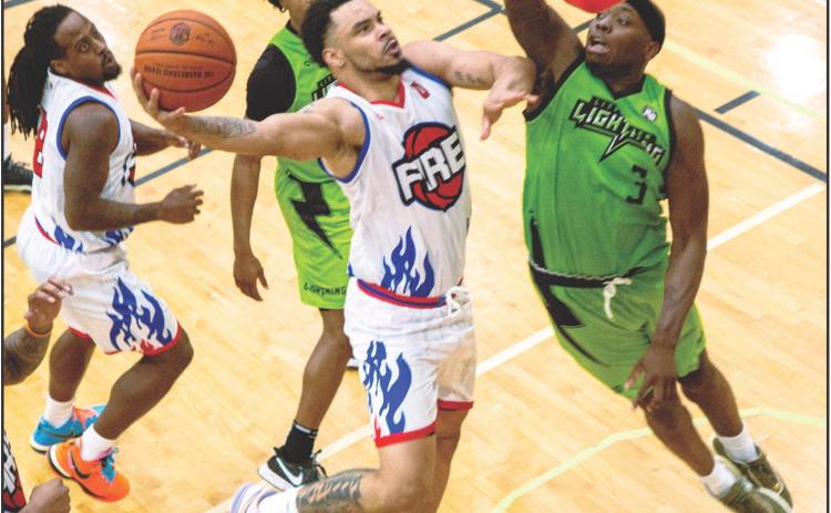 Potawatomi Fire’s Deshawn Munson goes in for a layup during the recent game against the Little Rock Lightning. Photo by Landon Kidney