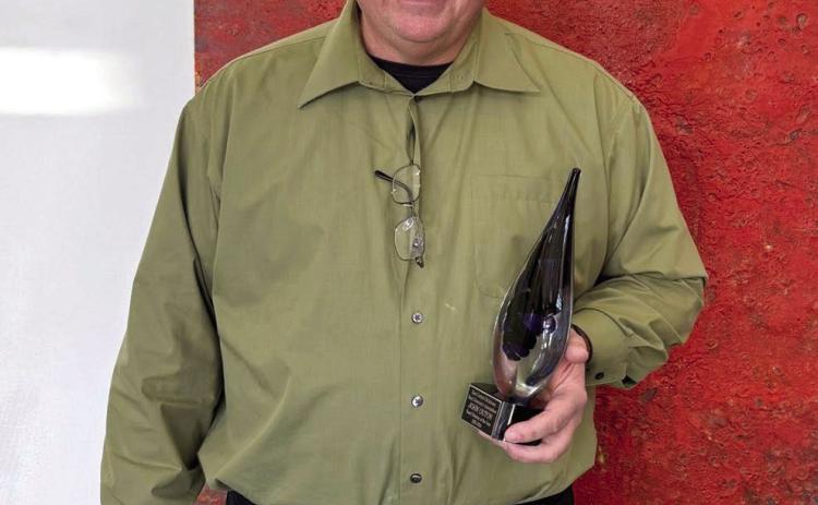 Tecumseh Band Director John Outon was named the East Central Oklahoma Band Directors' Association Band Director of the Year on Jan. 10, after being chosen by 32 of his colleagues. Outon is shown with his award. Photo provided