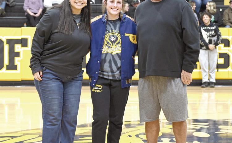 Tecumseh senior Cadence Leba received her All-State Fast Pitch jacket during halftime of the Savages' home game on Jan. 13. Shown, from left, are Fast Pitch Assistant Coach Aspen Grimes, Leba and Fast Pitch Assistant Coach Perry Wilson. Photo courtesy of Kenetta Lisenbee