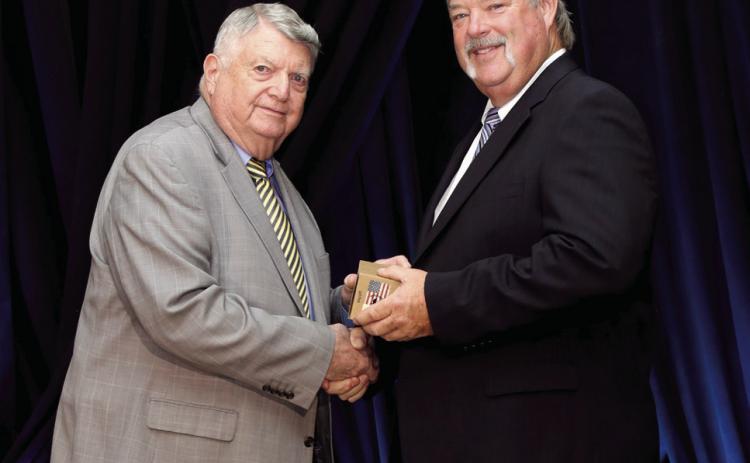 Dr. Phil Berkenbile presents award to Randy Gilbert at the Career Tech Hall of Fame event held Oct. 3. Photo provided