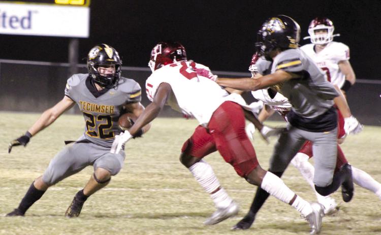 Tecumseh senior Maddox Anderson dodges a Tuttle defender while carrying the ball in the third quarter of the home game, Oct. 20. The Savages lost, 6-50. Countywide &amp; Sun/Natasha Dunagan