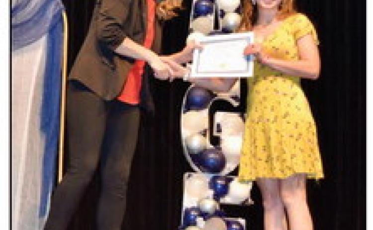 Shawnee High School Assistant Principal Megan Bloom (left) presents 11th Grader Evelyn Miner with a pin and certificate recognizing Miner as part of Shawnee Advanced Gifted Education (S.A.G.E.) in a recent ceremony. Photo provided