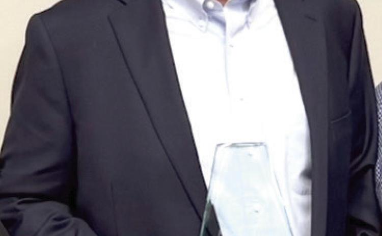 Tecumseh Lady Savage Fast Pitch Head Coach Chad Trahan poses with his Oklahoma High School Fastpitch Softball Coaches Association Hall of Fame award. Photo provided