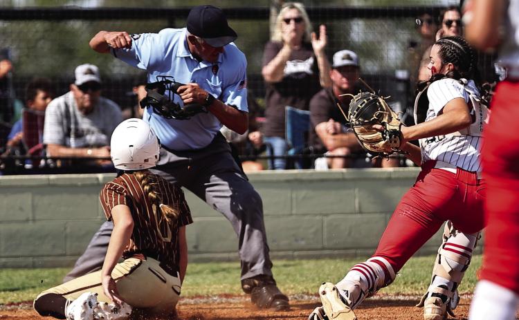 North Rock Creek’s Sarah Campbell tags the Elk City runner for the out in action during Super Regionals on Oct. 10. The Lady Cougars lost two games with Elk City, 3-4 & 1-7, to end their season with a record of 31-8. Photo courtesy of Gowin Photography