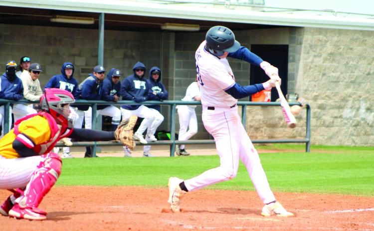 Shawnee’s Toby Gray makes contact with the ball during the Bill Tipton Classic game against Dale on April 6. The Wolves lost to Dale, 5-9, and to Elgin, 1-7, and they won their games with El Reno, 5-2, and Putnam City North, 15-0, in tournament play. Countywide &amp; Sun/Natasha Dunagan
