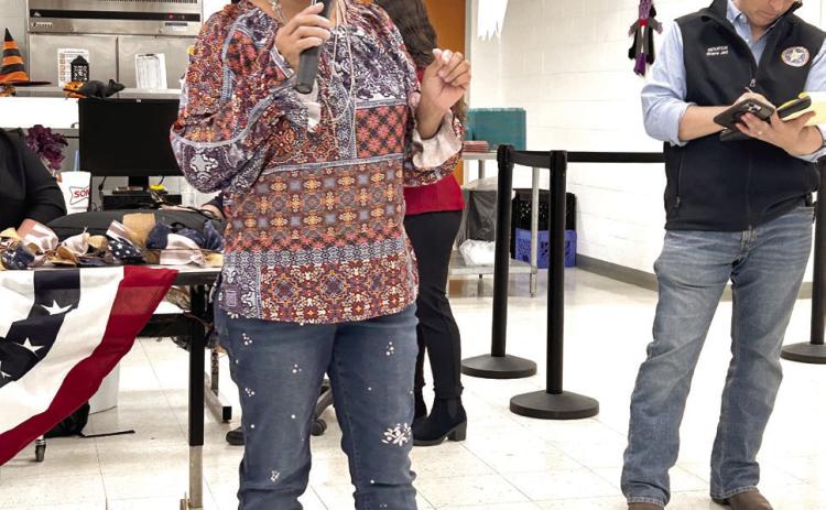 Donna Heins (above center) addresses the crowd during the Town Hall meeting held at McLoud School. Sen. Shane Jett (pictured right) hosted the event. Countywide &amp; Sun/ Suzie Campbell