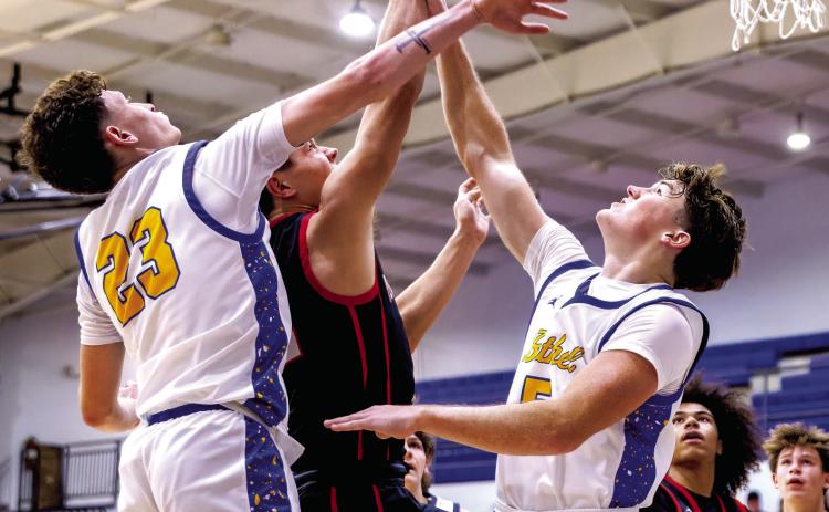 Bethel seniors Darius Cheatham and Zack Jennings defend the bucket during the Dec. 11 game against Perkins-Tryon in the Bethel First United Basketball Classic. The Wildcats lost that game, 52-67, and a close game against Sallisaw, 62-65, before winning with Pauls Valley, 53-48. Photo courtesy of Richelle Treece
