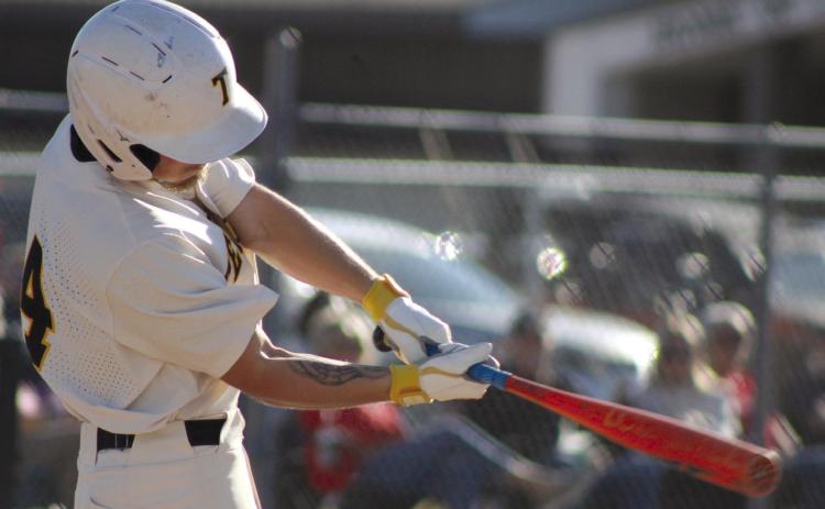 Tecumseh senior Bryson Smith swings at bat, but eventually takes a walk, during the April 4 game with North Rock Creek. The Savages lost, 0-3. Countywide & Sun/Natasha Dunagan